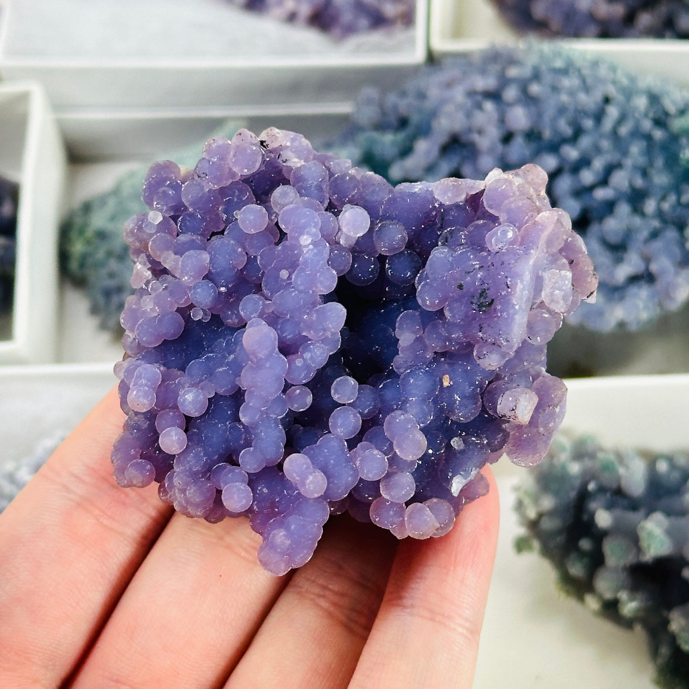 GRAPE AGATE WITH DECORATIONS IN THE BACKGROUND