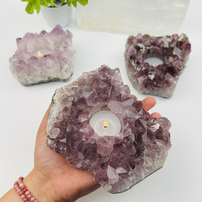 Amethyst Cluster Candle Holder in hand for size reference 