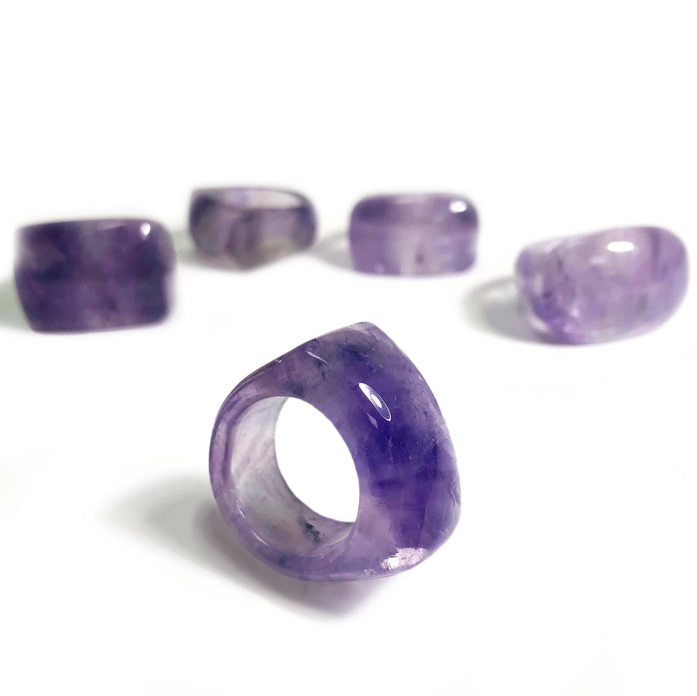 Amethyst rings on a white background.