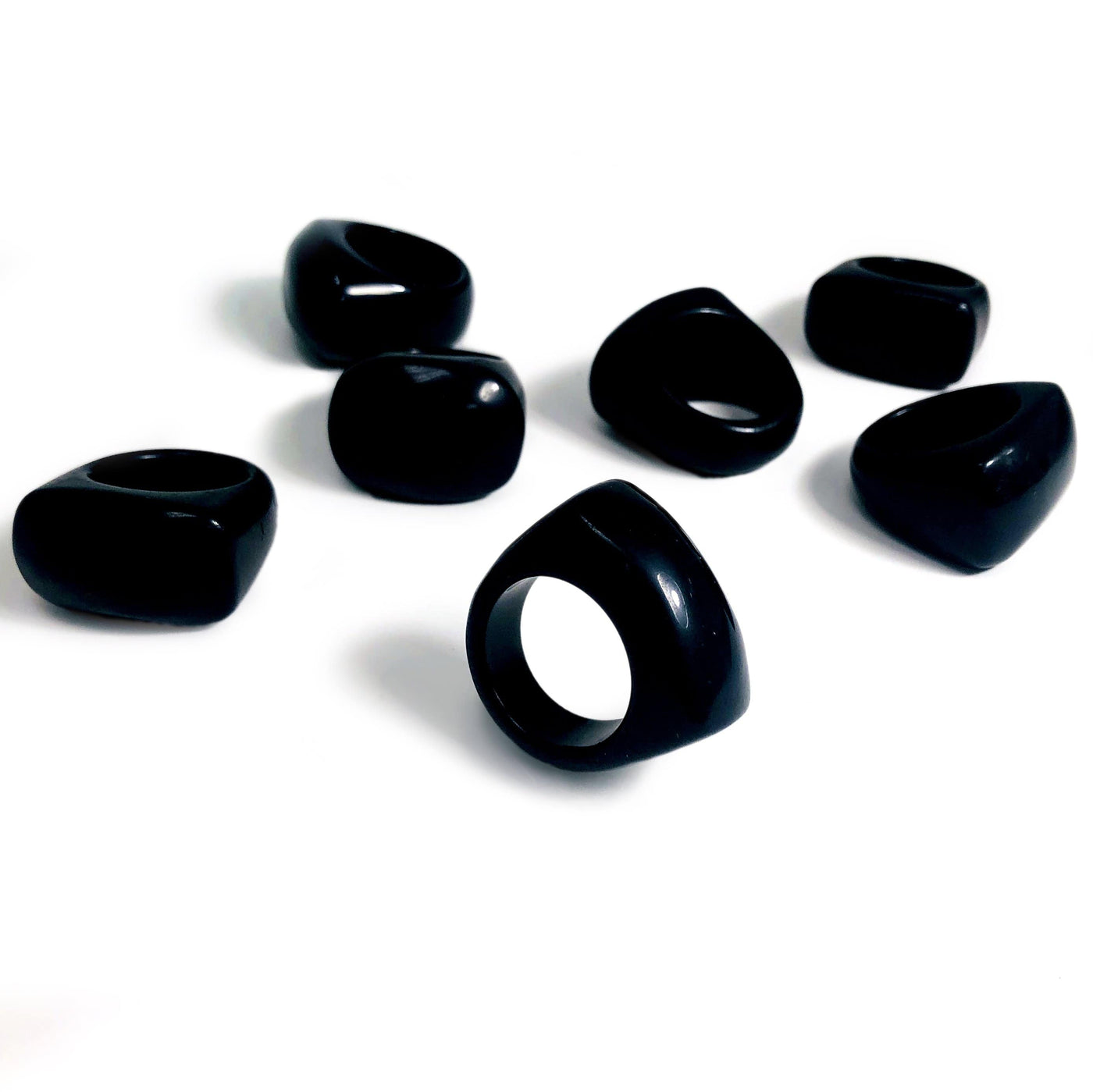 black obsidian rings on a white background.