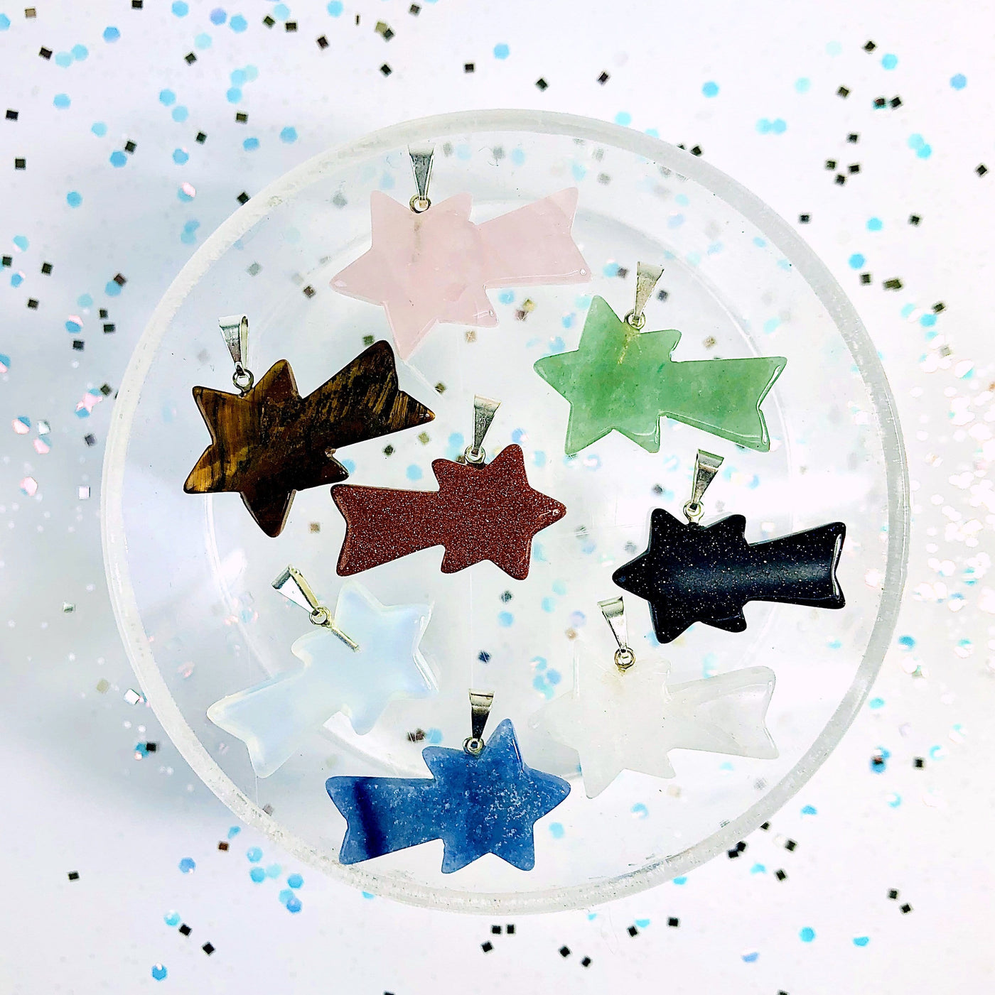 overhead view of all shooting star stone pendant options on display