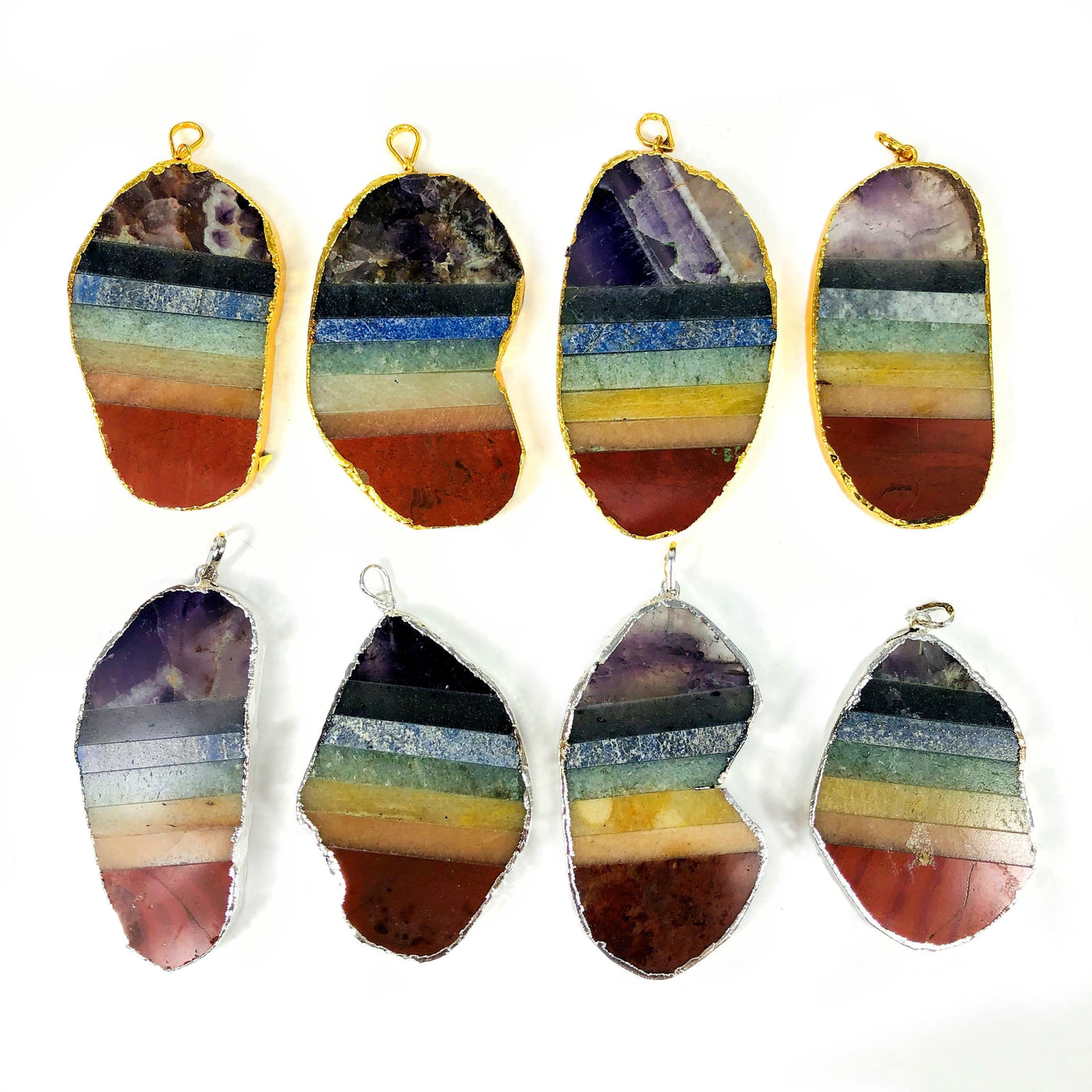 chakra slice pendants displayed in gold and silver 