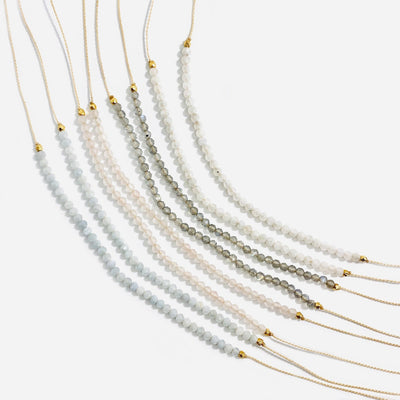Gemstone Bead Finished Necklaces in different ighter stones on a white background