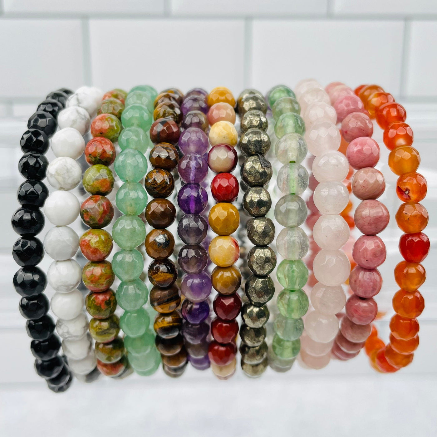 Round Bead Faceted Bracelets - 6mm - displayed to show the differences in the crystal types 