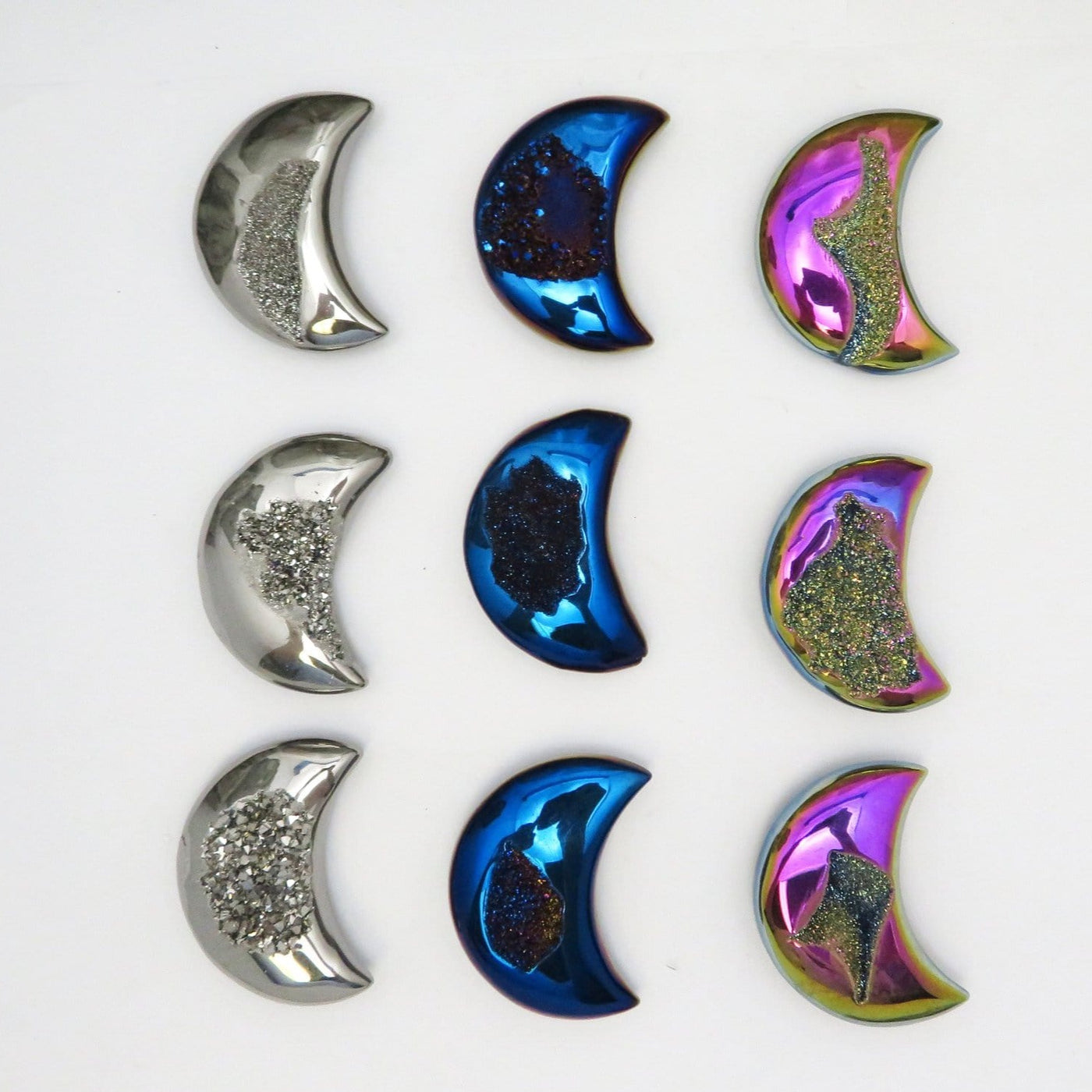 Titanium Druzy Moons in different colors on white background