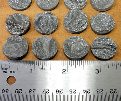 8 Titatium Druzy Round Cabachons lined up next to a ruler for size reference