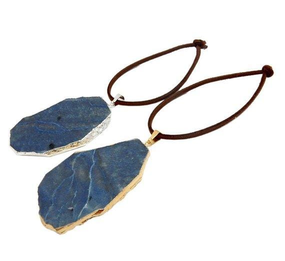 blue quartz ornaments displayed in silver and gold with brown faux leather tie side view for thickness reference