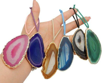 Freeform Gold Trim Agate Christmas Ornaments - all colors held in a hand