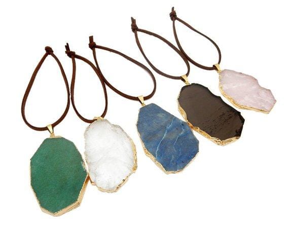 Freeform Gold Gemstone Christmas Ornaments displayed to show all gemstone styles in green aventurine crystal quartz blue quartz Smokey quartz rose quartz with brown faux leather attached for hanging