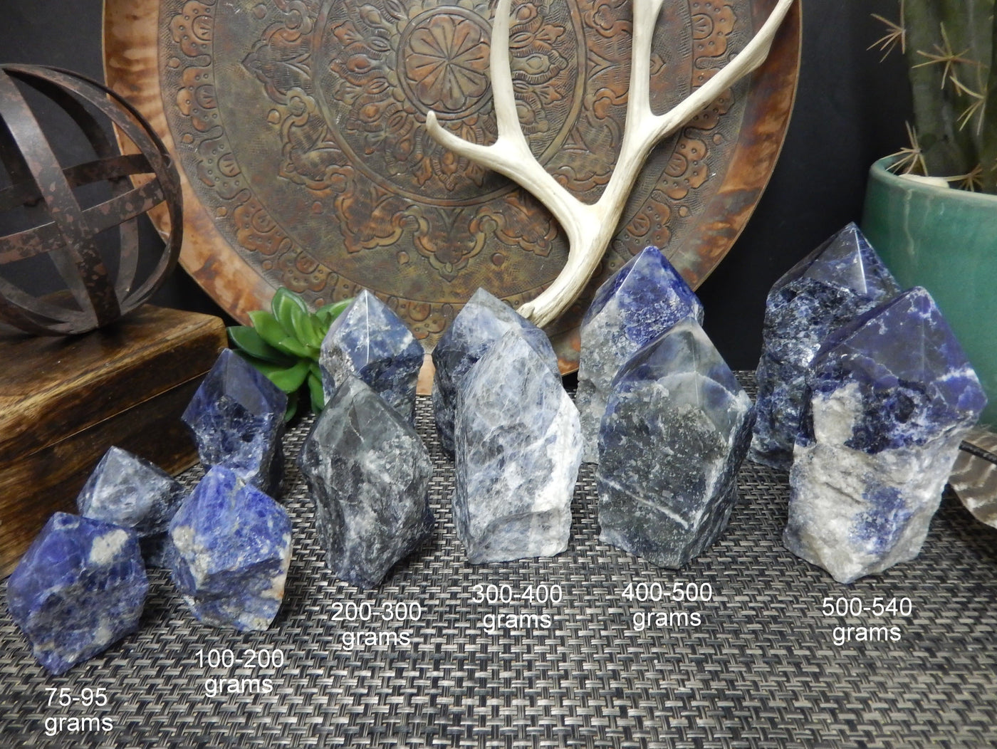 semi polished points of different sizes with decorations in the background