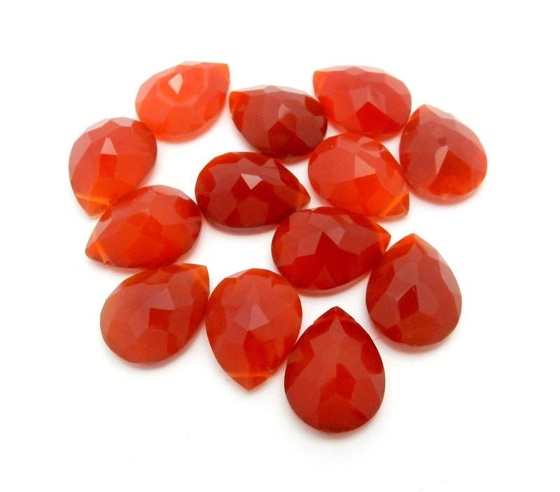 13 Red Onyx  Briolette scattered on white background