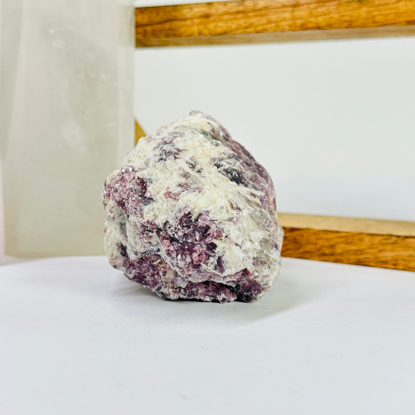 lepidolite with decorations in the background