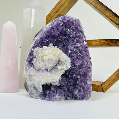 amethyst cut base with decorations in the background