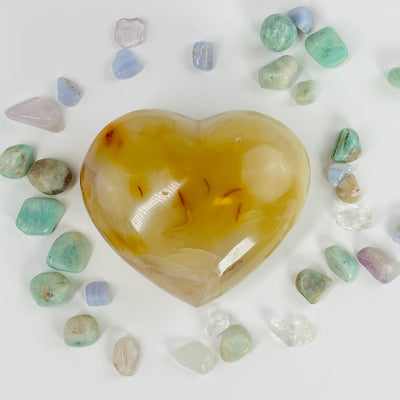 carnelian heart surrounded by other crystals