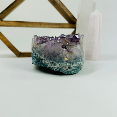 amethyst bowl with decorations in the background