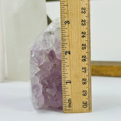 amethyst POINT next to a ruler for size reference