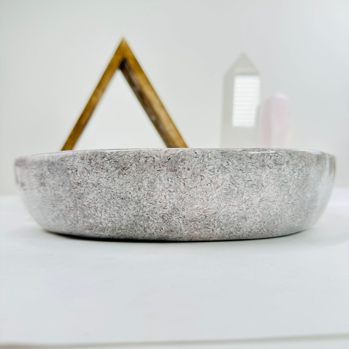 pink amethyst bowl with decorations in the background