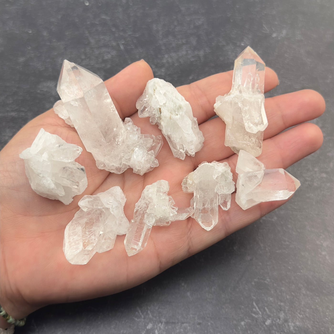 crystal clusters in hand for size reference 