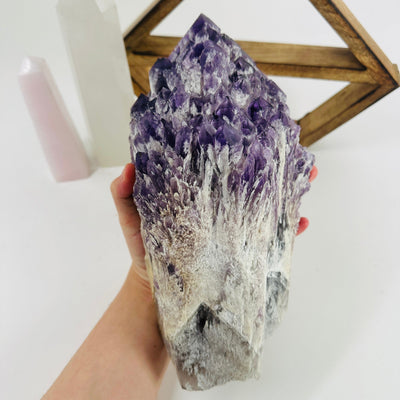 elestial amethyst with decorations in the background