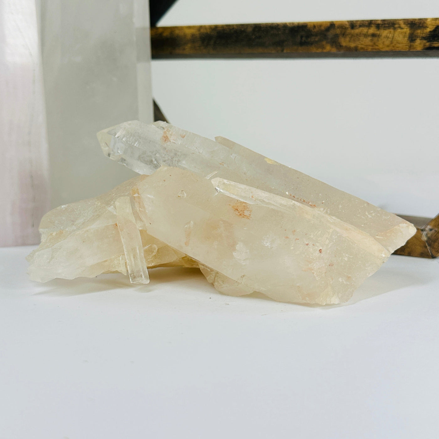 lemurian tangerine quartz with decorations in the background