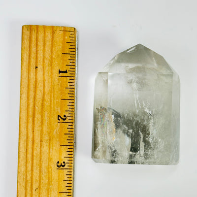 lodalite point next to a ruler for size reference