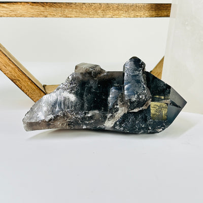 smokey quartz with decorations in the background