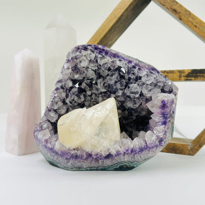 amethyst cut base with decorations in the background