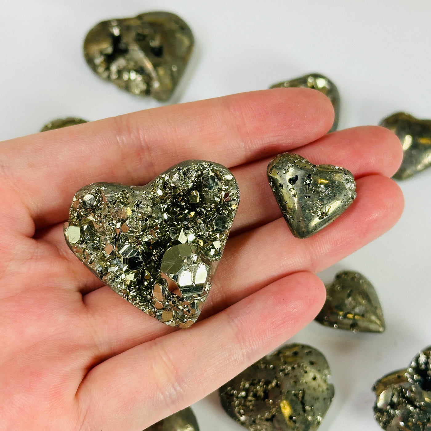 pyrite heart with decorations in the background