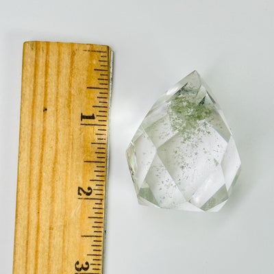 lodalite point next to a ruler for size reference