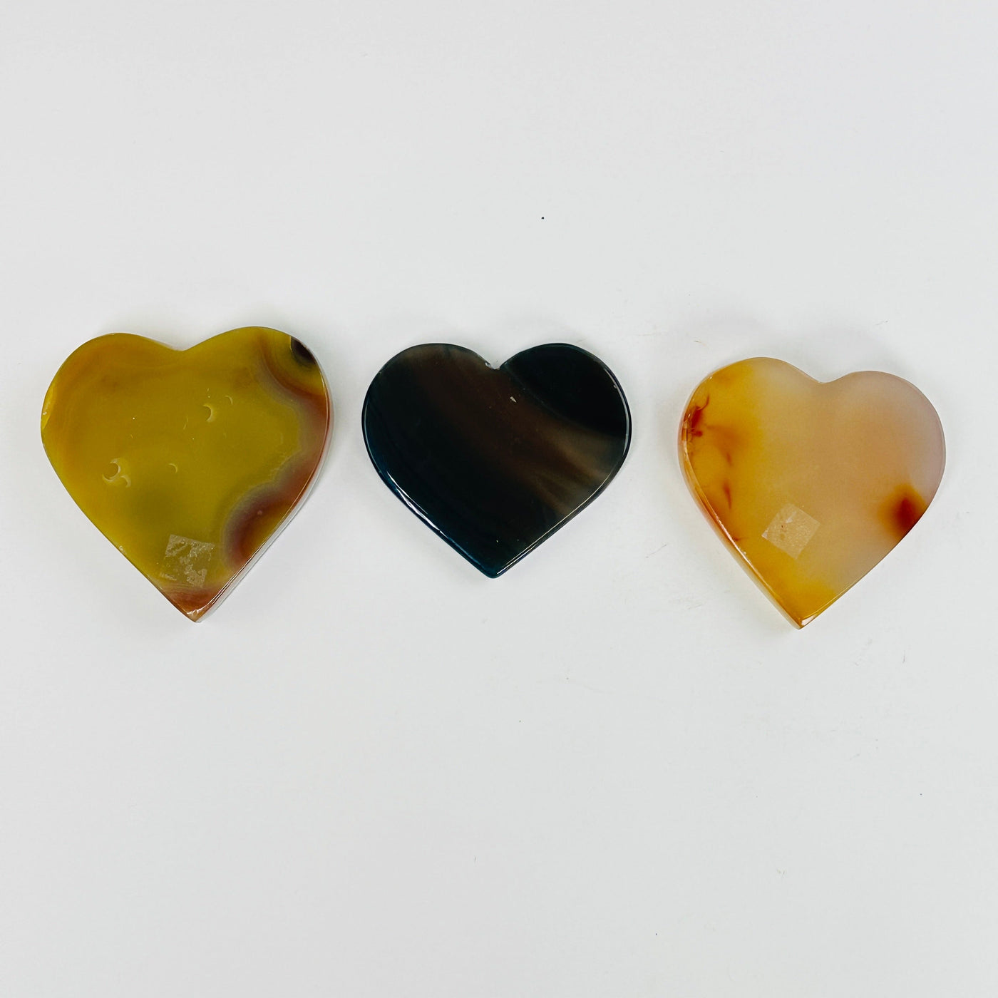 natural agate heart slices on white background