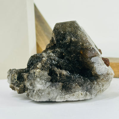 rutile quartz with decorations in the background