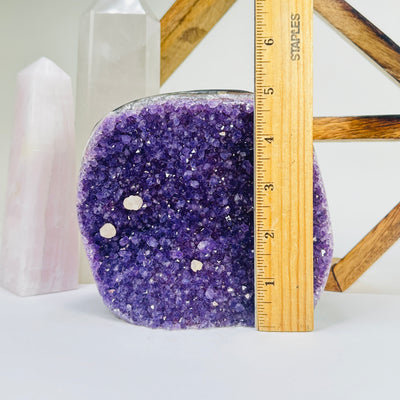 amethyst cut base next to a ruler for size reference