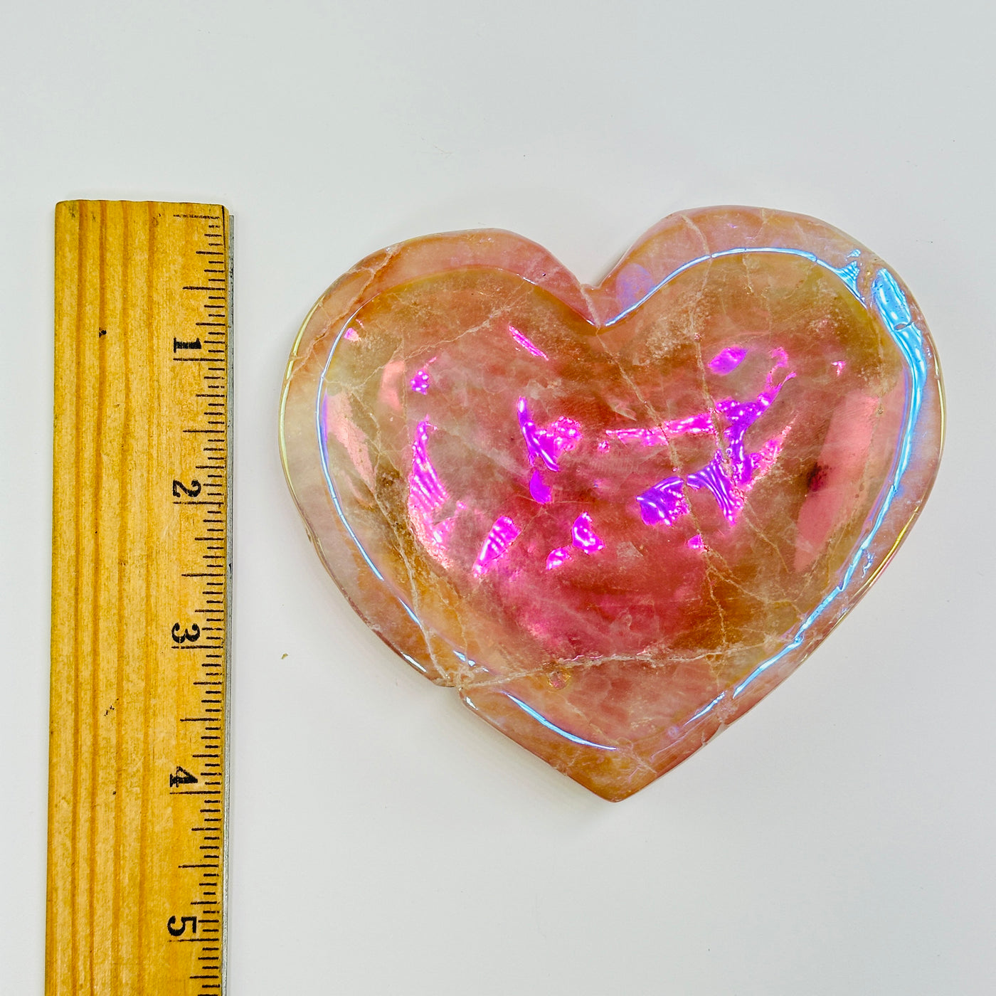 rose quartz bowl with decorations in the background