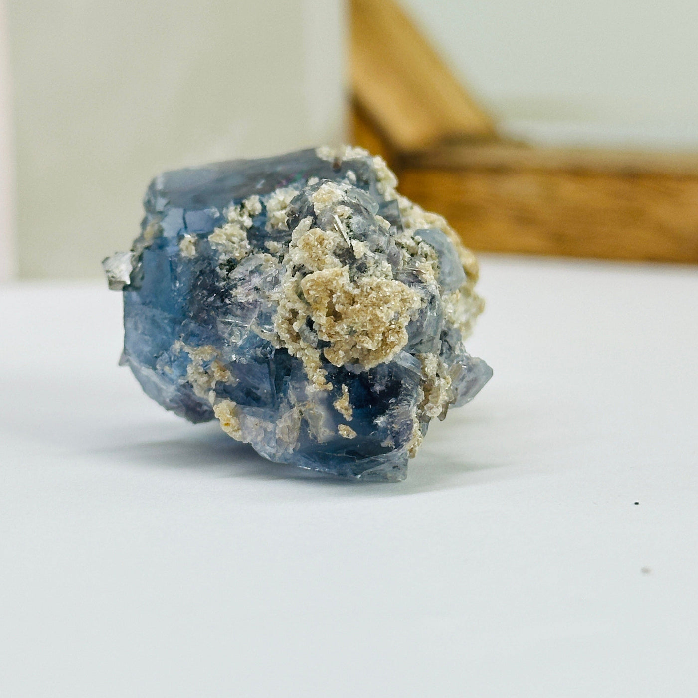 blue fluorite with decorations in the background