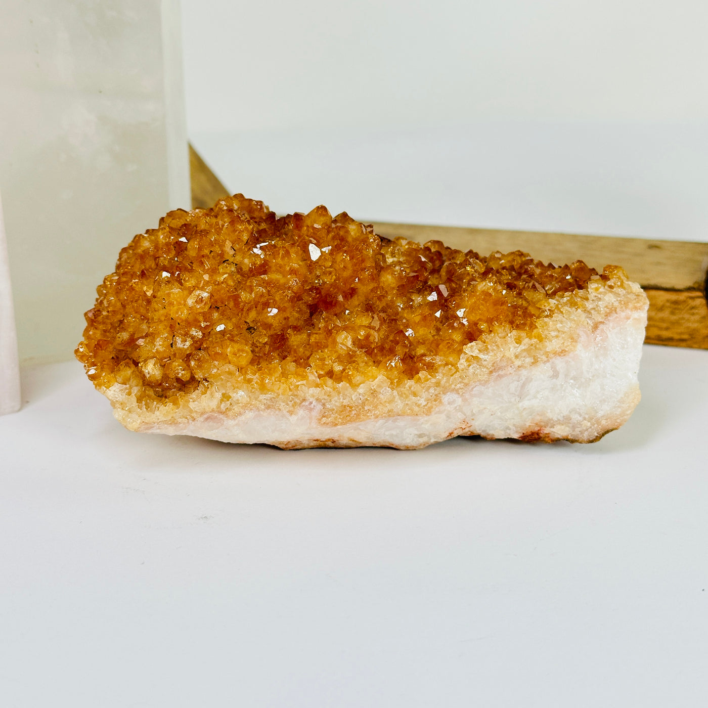 citrine cluster with decorations in the background