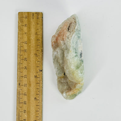 fluorite cut base next to a ruler for size reference