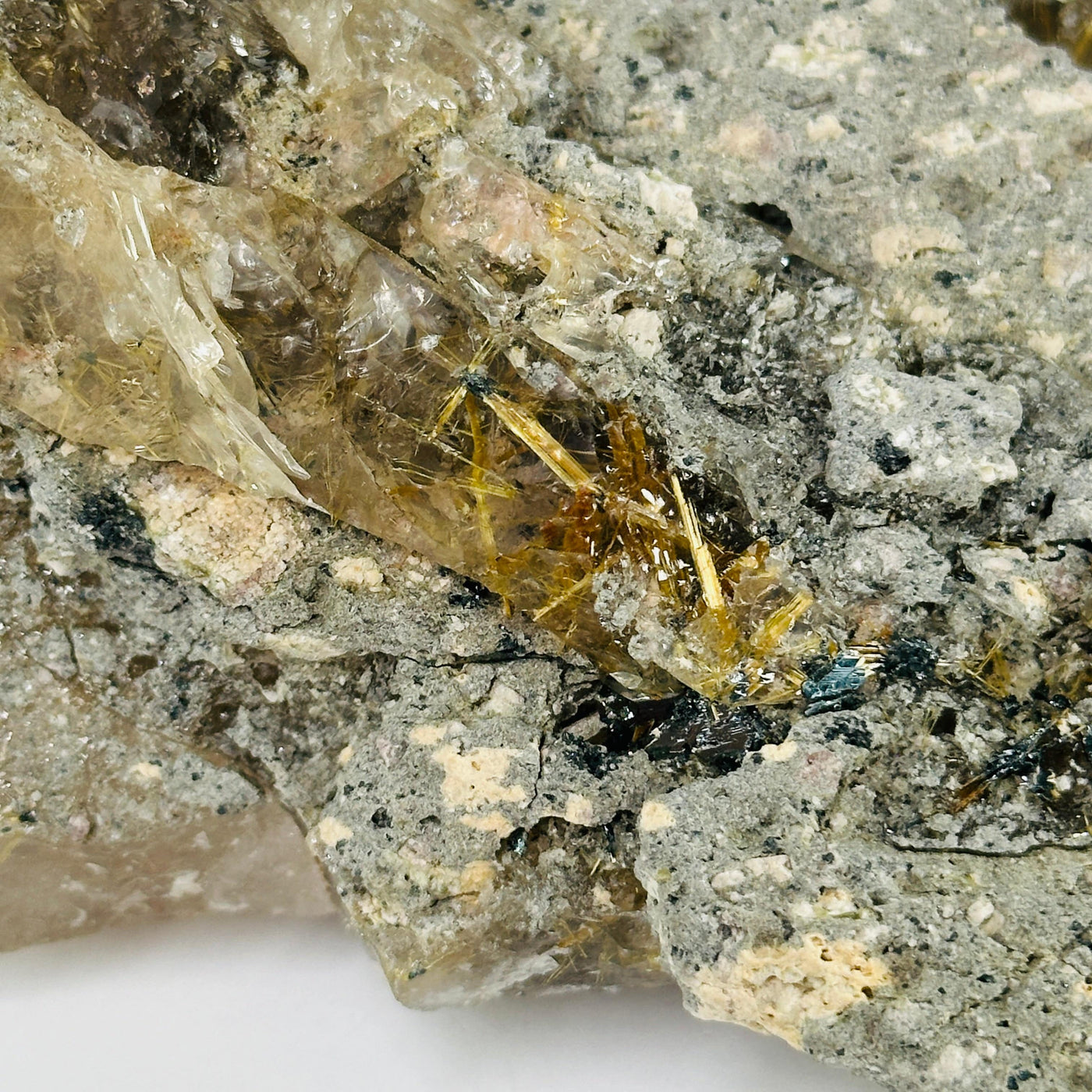 rutile quartz with decorations in the background