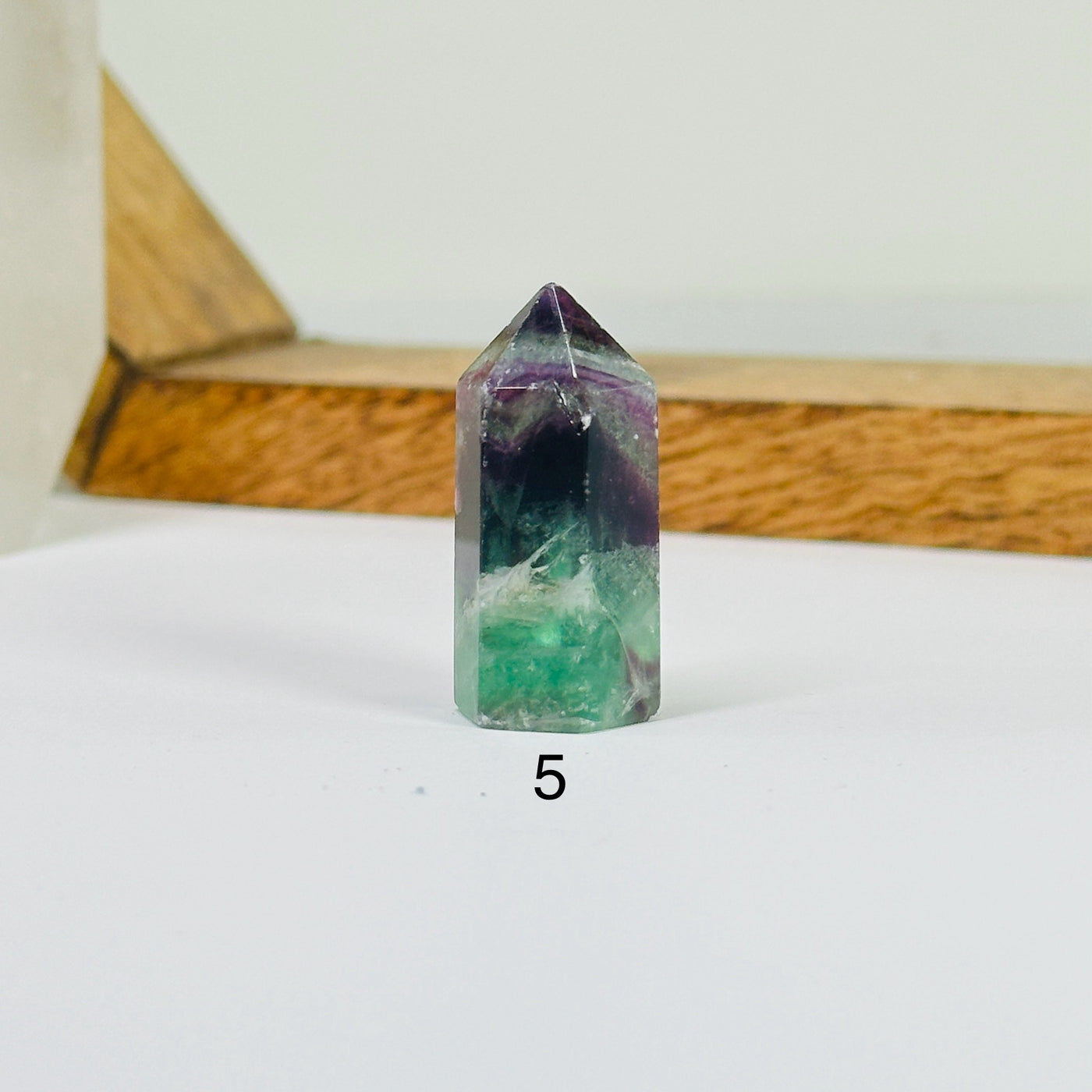 fluorite points with decorations in the background