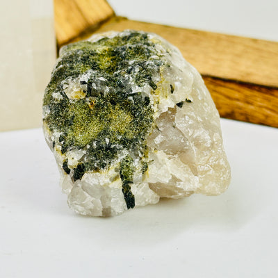 tourmaline with decorations in the background