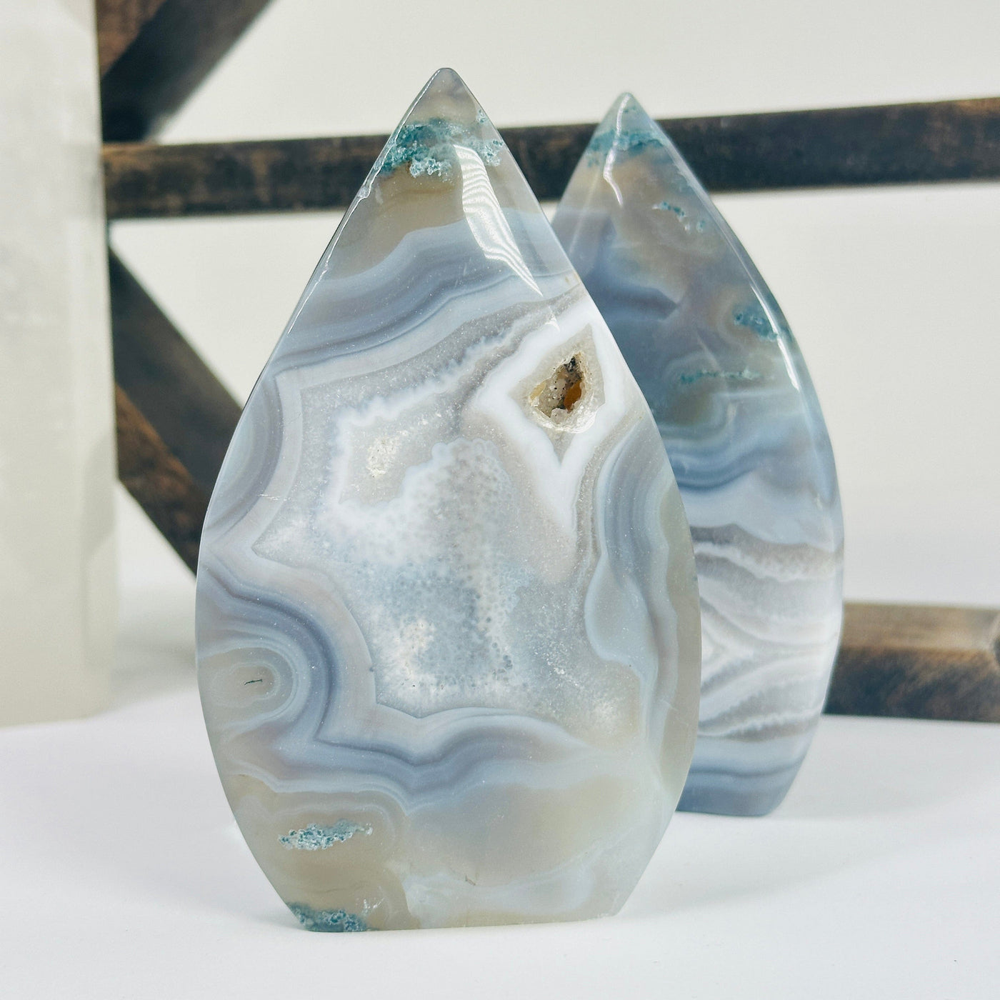 moss agate cut base with decorations in the background