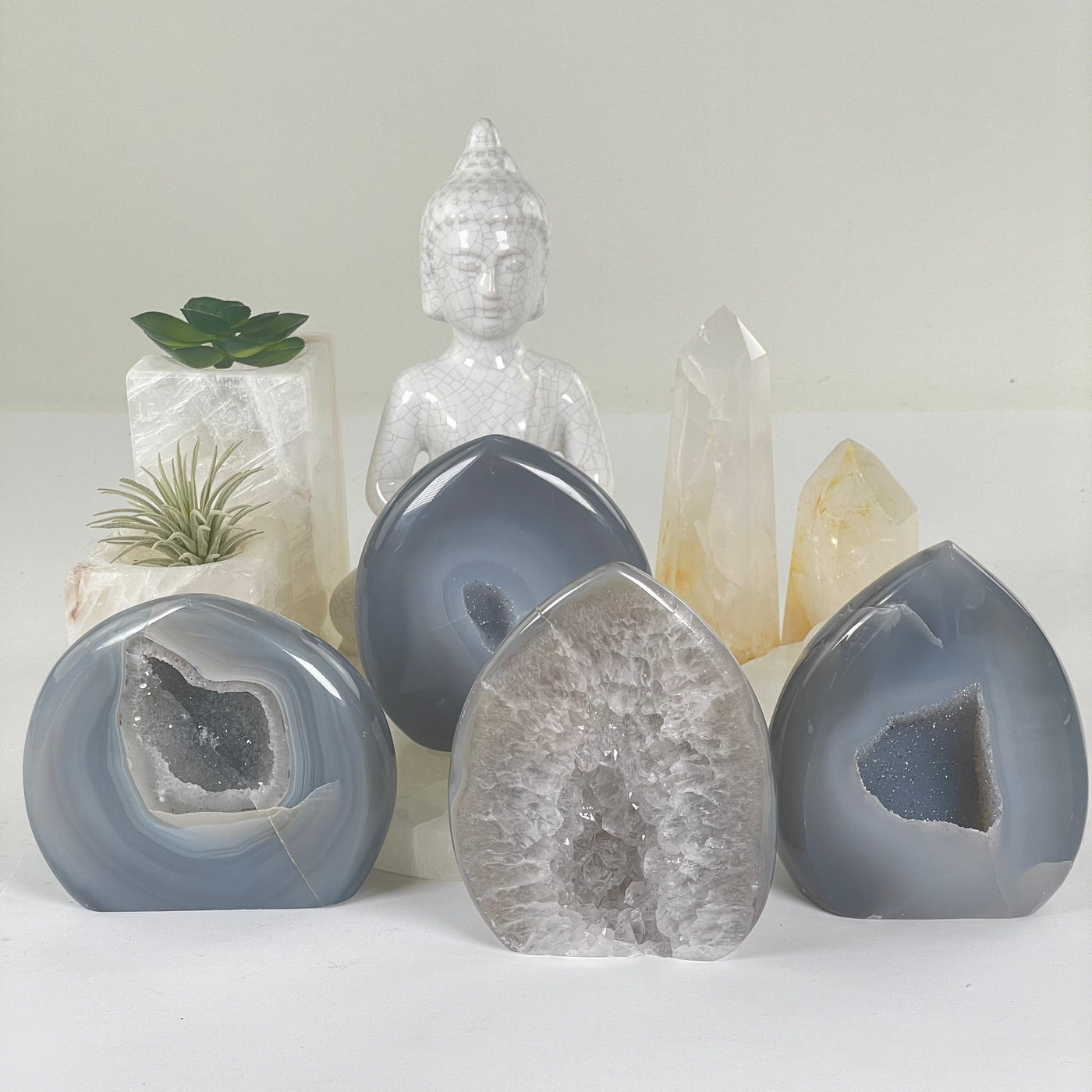 Agate Druzy Teardrop Crystal Cut Base - You Choose #1 all variants with props and plants in the background