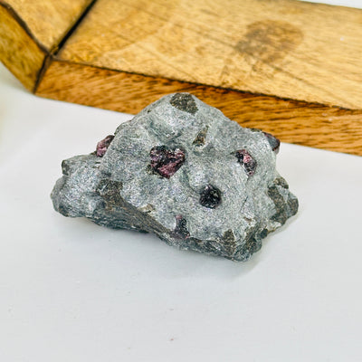 hematite with garnet with decorations in the background