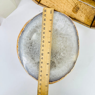 agate bowl next to a ruler for size reference