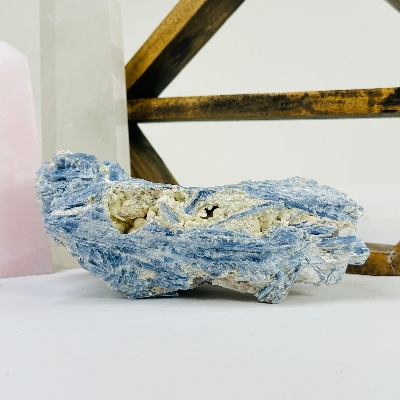 kyanite with decorations in the background