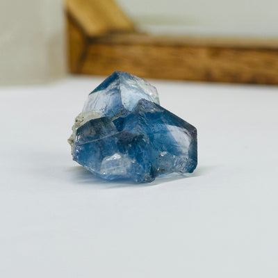 blue fluorite with decorations in the background