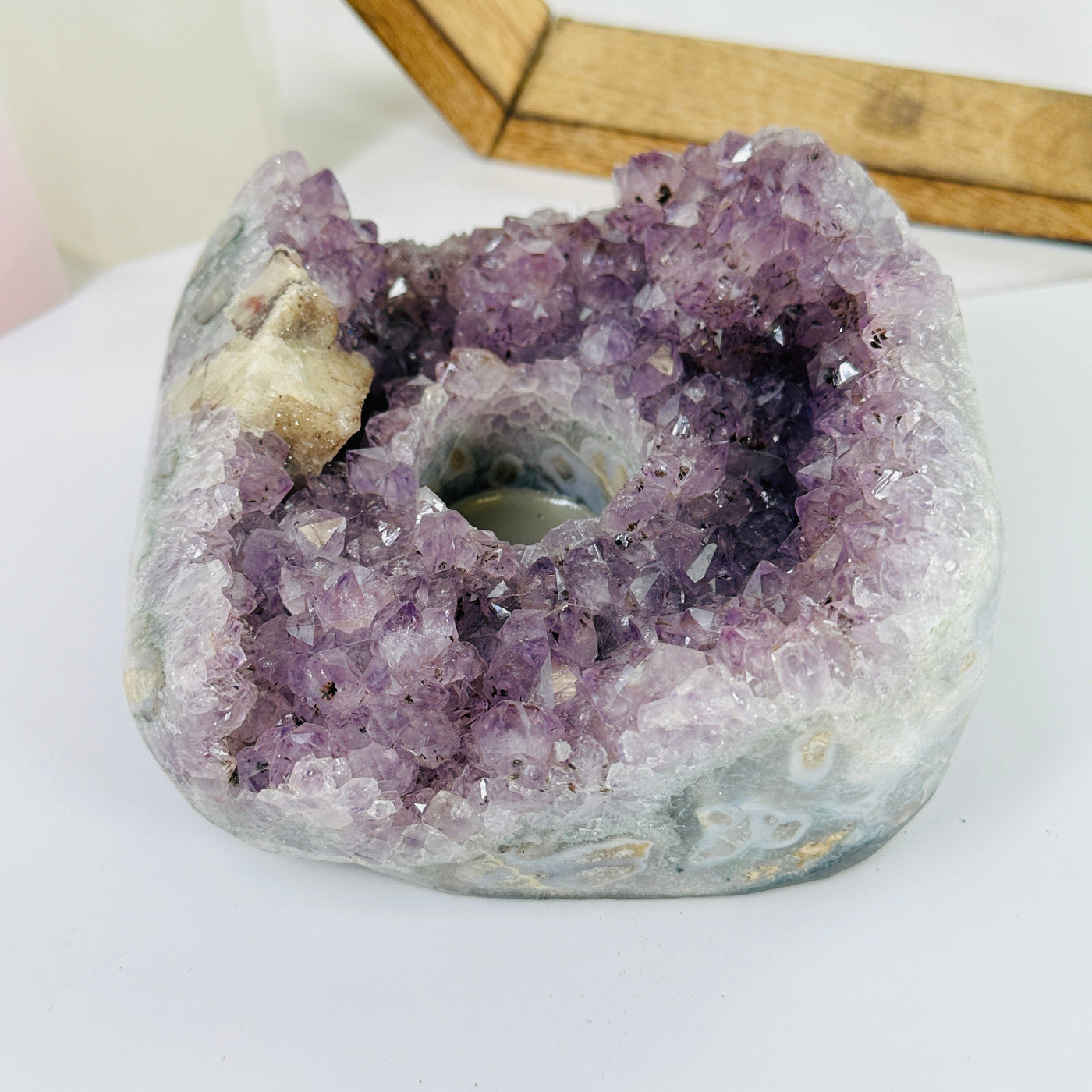 amethyst candle holder with decorations in the background