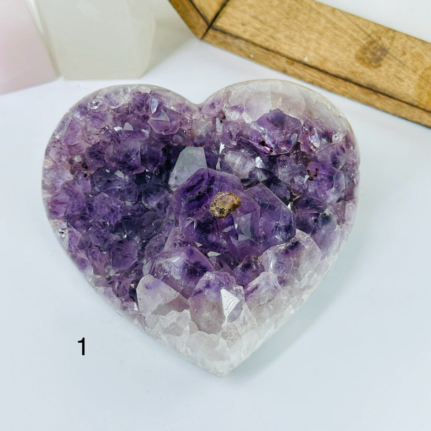 AMTHYST HEARTS WITH DECORATIONS IN THE BACKGROUND