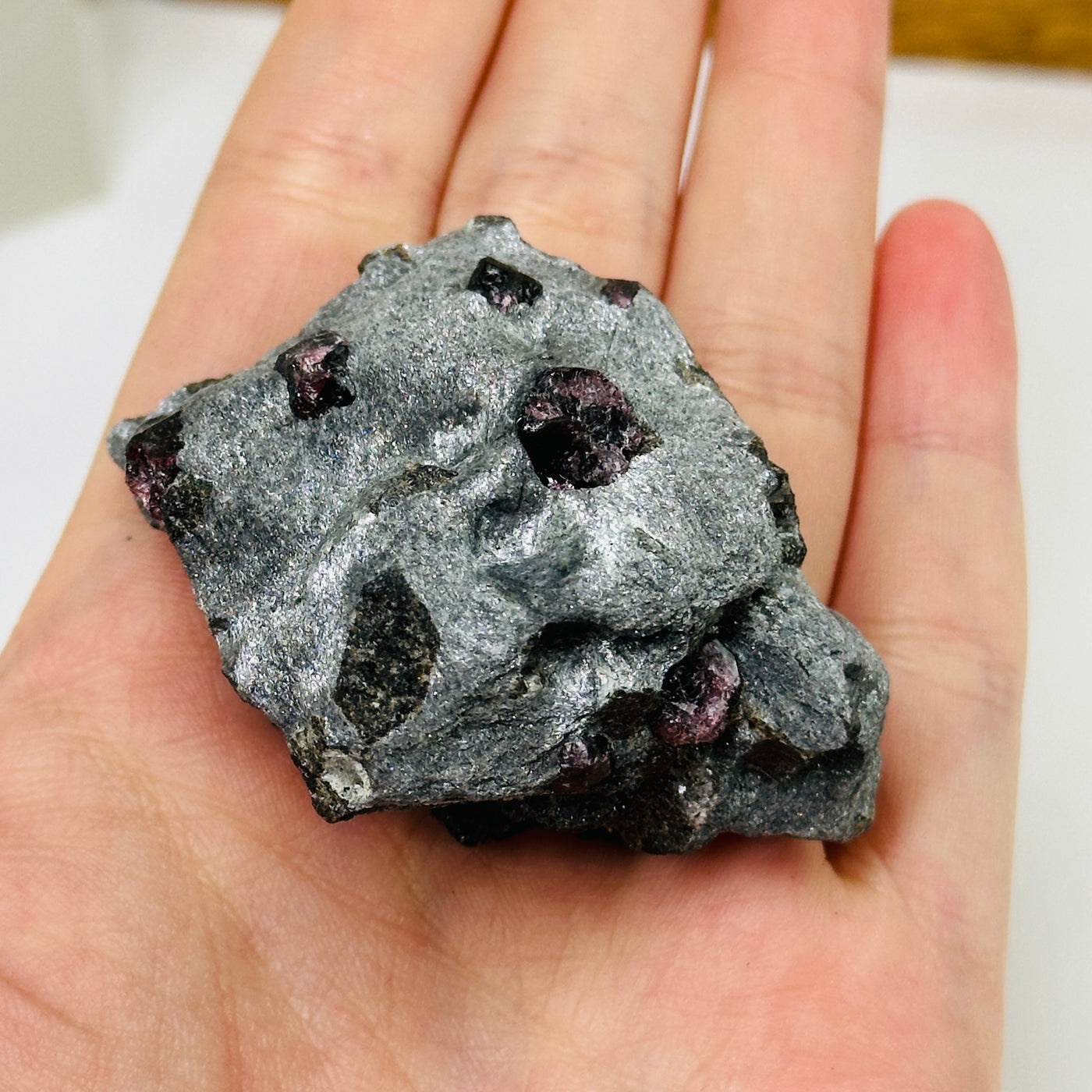 hematite with garnet with decorations in the background