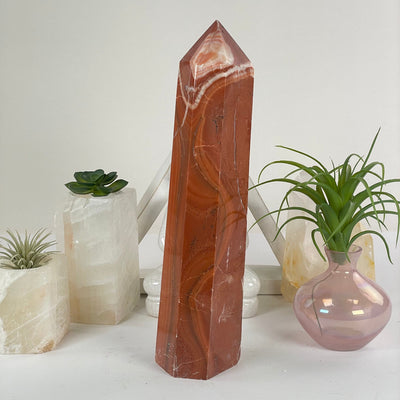 Red Jasper Crystal Obelisk on display