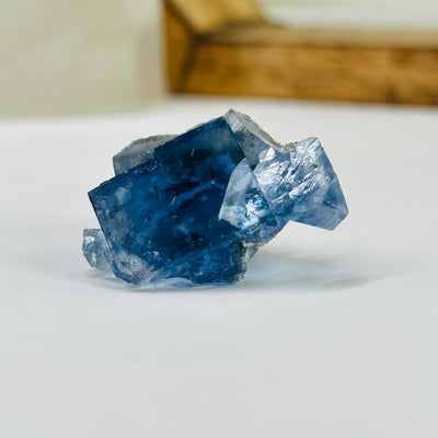 blue fluorite with decorations in the background